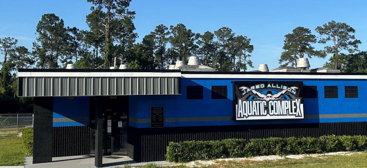 Jared Allison Aquatic Complex|person swimming in pool at aquatic center